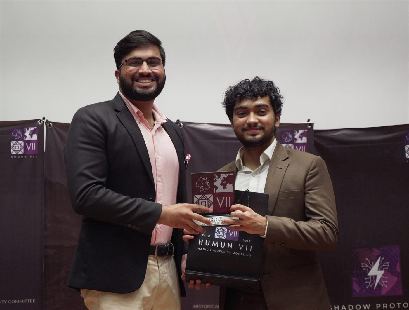 Ammar Hashmi receiving the Committee Director award at HUMUN VII, Habib University.