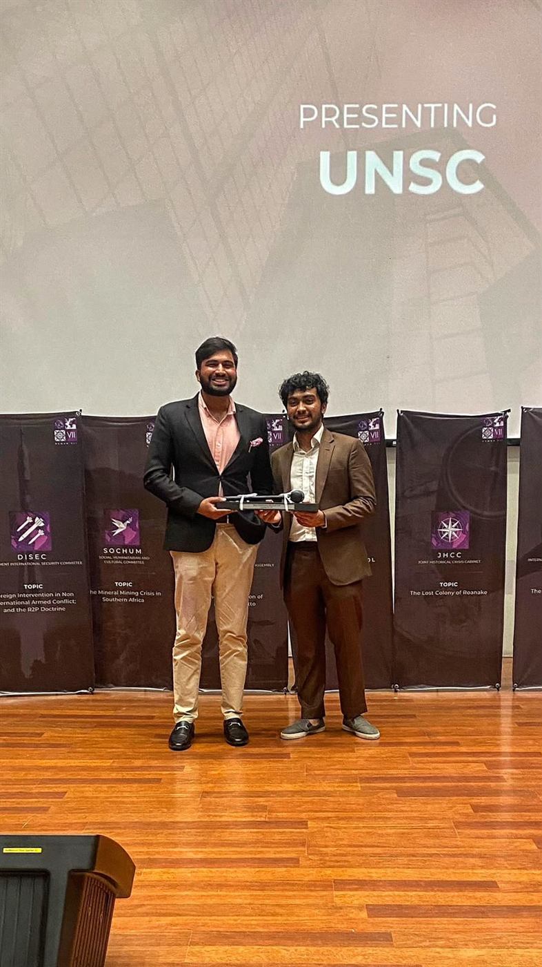 Ammar Hashmi accepting the Best Emerging Delegation award on the delegations' behalf at HUMUN, Habib University.