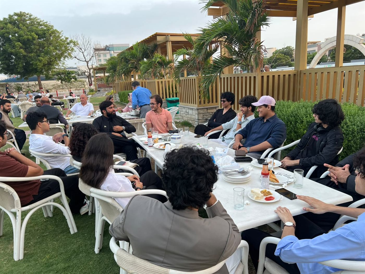 The MUN Society Pakistan team seated together during a working meeting.