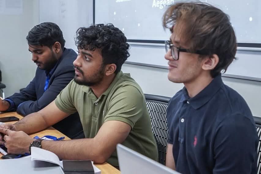 MUN Society Pakistan delegates working through research and committee preparation at a training session.